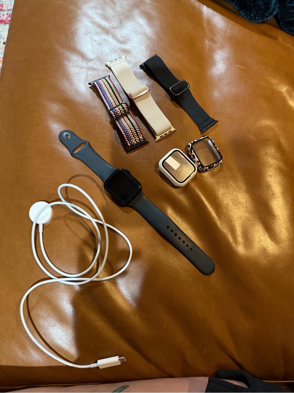 Apple Smartwatch Bundle with Black Watch and Multiple Colored Straps